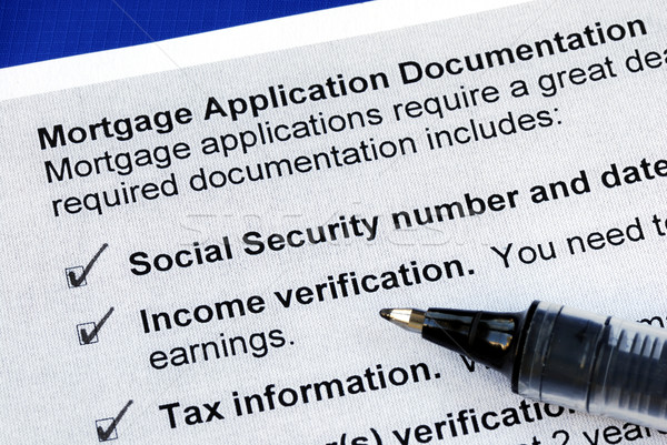 The documents required in a mortgage application isolated on blue Stock photo © johnkwan