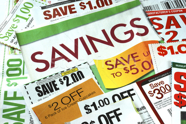 Stock photo: Cut up some coupons to save money 