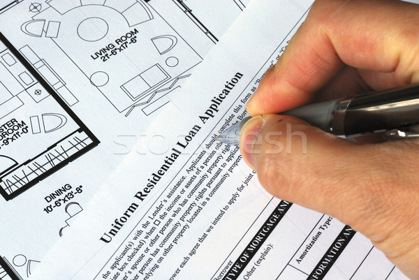 Fill in the mortgage application to buy a real estate property Stock photo © johnkwan