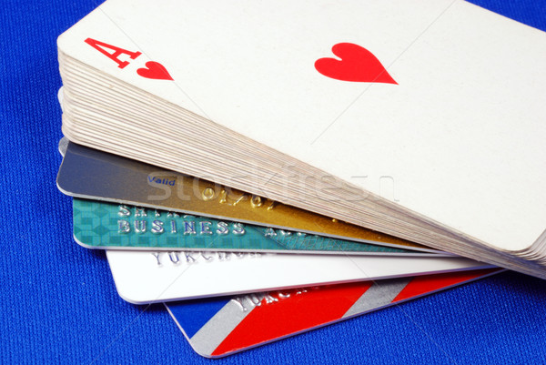 Play cards with credit cards concepts of gambling on credits Stock photo © johnkwan