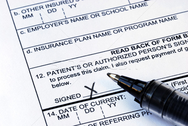 Stock photo: The patient signs the medical claim form