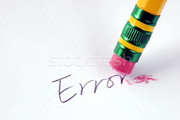 Erase the word Error with a rubber concept of eliminating the error/mistake Stock photo © johnkwan