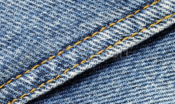 Denim material with seam running diagonally through the middle Stock photo © johnkwan
