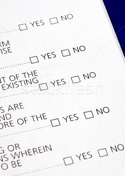 Select Yes or No from a questionnaire isolated on blue Stock photo © johnkwan