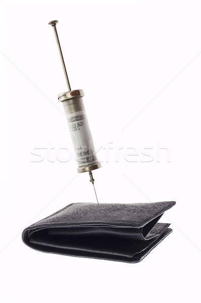 Cash injectie medische spuit geld binnenkant Stockfoto © johnnychaos