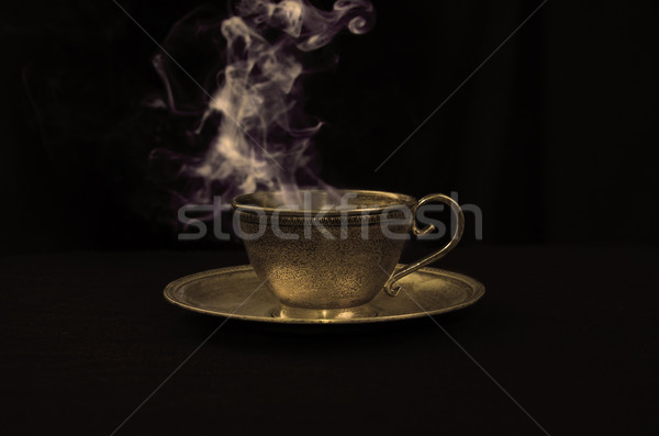 Quente café ouro antigo copo fumar Foto stock © johnnychaos