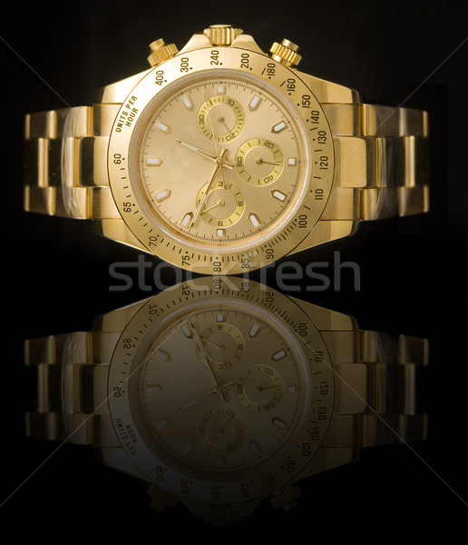 Luxury gold watch Stock photo © johnnychaos