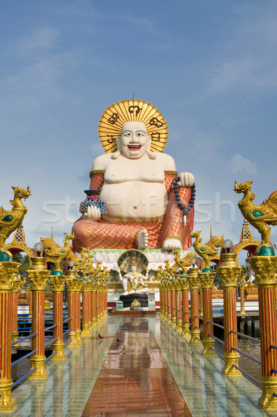 Fat laughing Buddha over blue sky Stock photo © johnnychaos