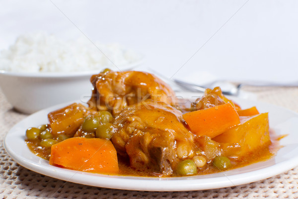 chicken afritada with bowl of rice closeup Stock photo © jomaplaon