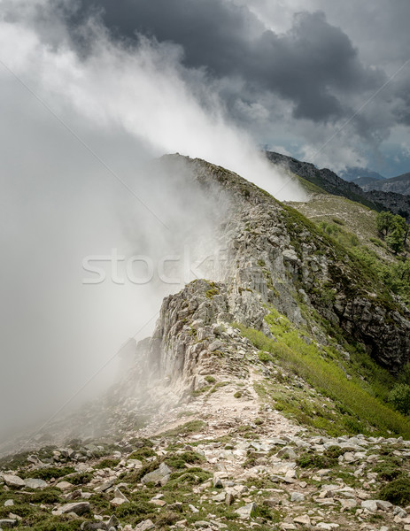 Clouds meet the top of a mountain ridge on GR20 in Corsica Stock photo © Joningall
