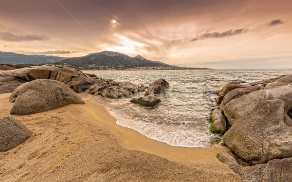 Rocks And Sand At Algajola Beach In Corsica Stock Photo