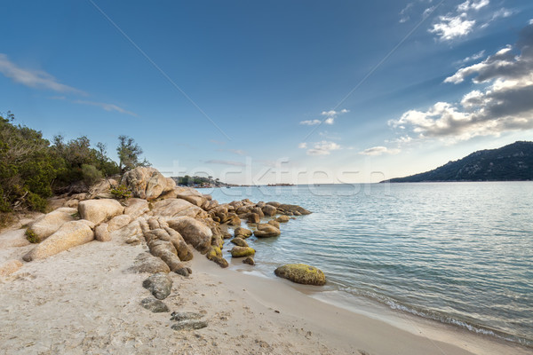 Boulders in a turquoise sea at Santa Giulia beach in Corsica Stock photo © Joningall
