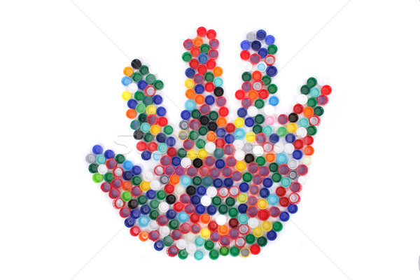 color plastic caps as hand Stock photo © jonnysek