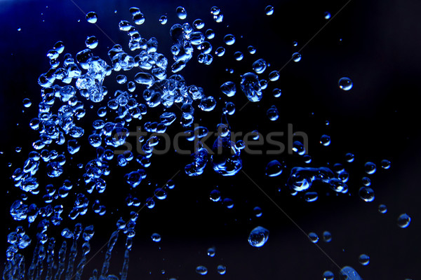 Druppels water Blauw kleur licht glas Stockfoto © jonnysek