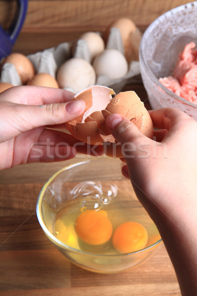 crashing eggs for preparing food Stock photo © jonnysek