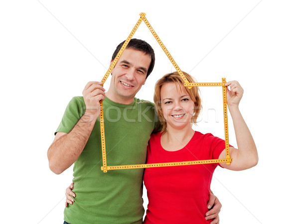 Happy couple with meter Stock photo © joseph73