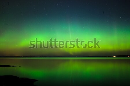 Stock photo: Northern lights over lake in finland