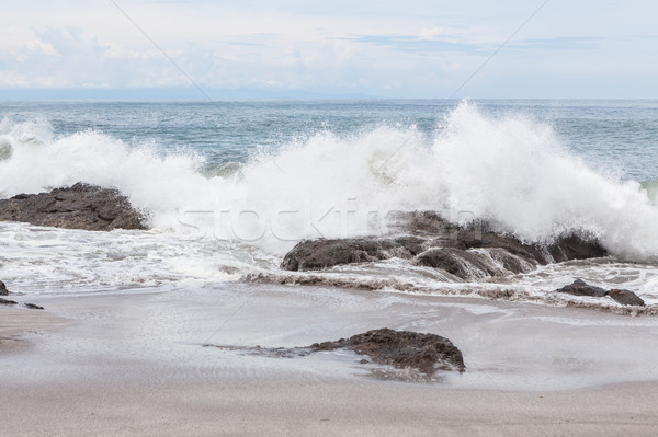 Waves crashing to rocks montezuma beach Stock photo © Juhku