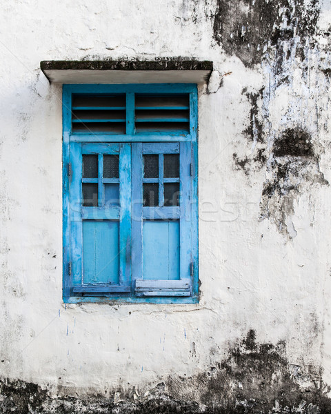 Vivid blue wooden window and grunge wall Stock photo © Juhku