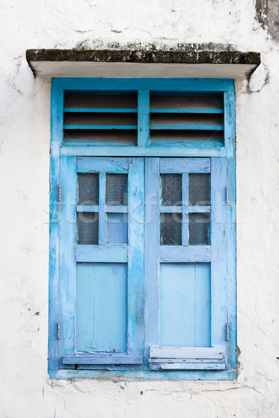 Blue wooden window and grunge wall Stock photo © Juhku