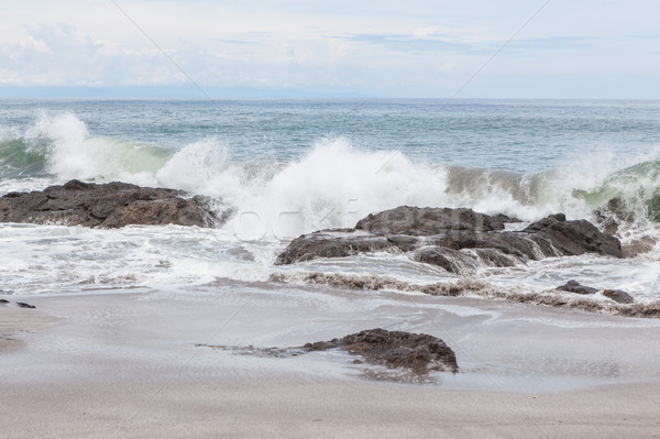 Waves crashing to rocks montezuma beach Stock photo © Juhku
