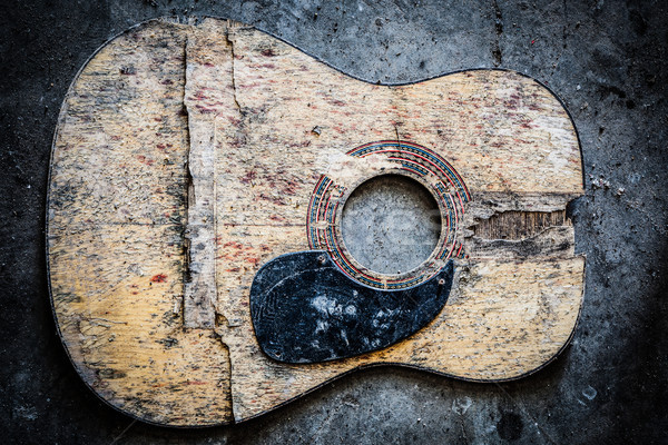 Quebrado violão guitarra confuso concreto piso Foto stock © Juhku