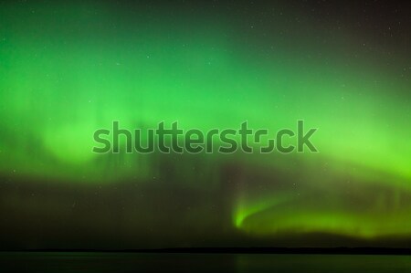 Northern lights over lake in finland Stock photo © Juhku