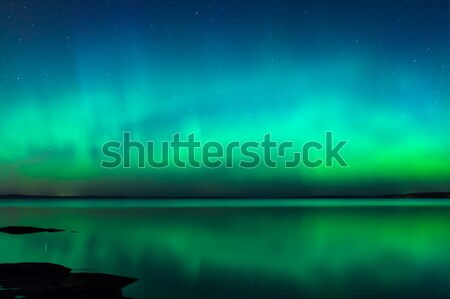 Stock photo: Northern lights over lake in finland