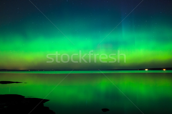 Stock photo: Northern lights over lake in finland