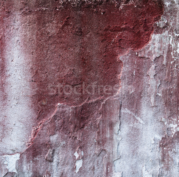 Broken concrete wall and faded red paint Stock photo © Juhku