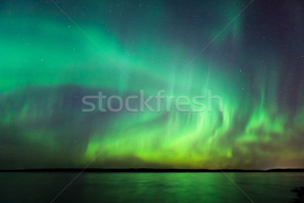 Northern lights over lake in Finland Stock photo © Juhku