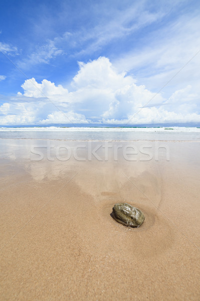 Waves sand beach and clouds sunny day Stock photo © Juhku