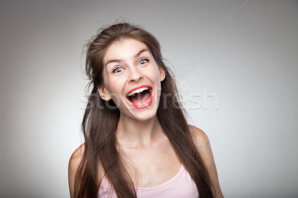 Crazy girl screaming loud. Stock photo © julenochek