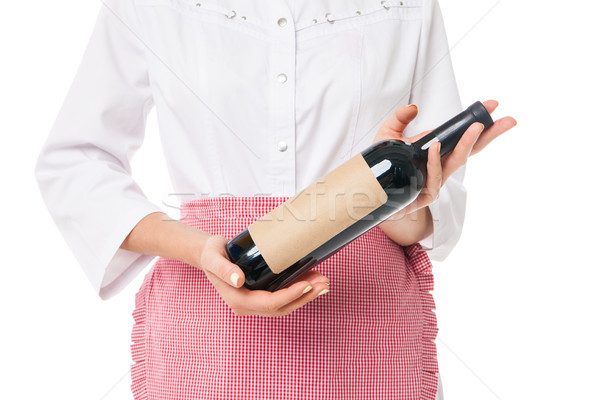 Close-up of woman's hand holding bottle with wine Stock photo © julenochek