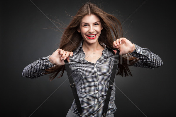 Boldog nő húz nadrágtartó nyújtás iroda Stock fotó © julenochek