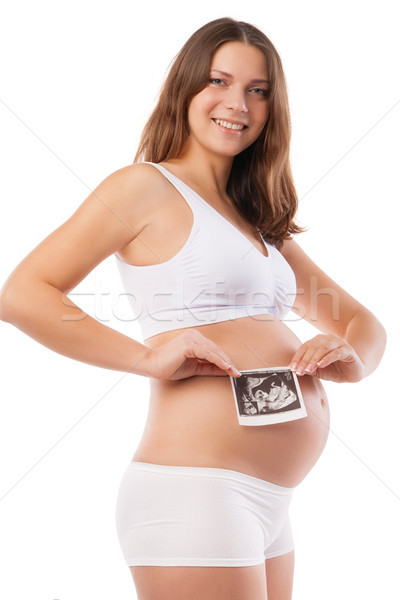 Pregnant woman is holding photo of her Ultrasound Stock photo © julenochek