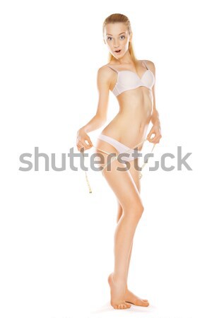 Pretty young woman wearing tank top and briefs moving isolated Stock photo © julenochek