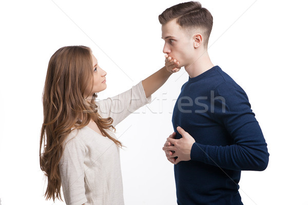 Side view of girl covering man's mouth with hand Stock photo © julenochek