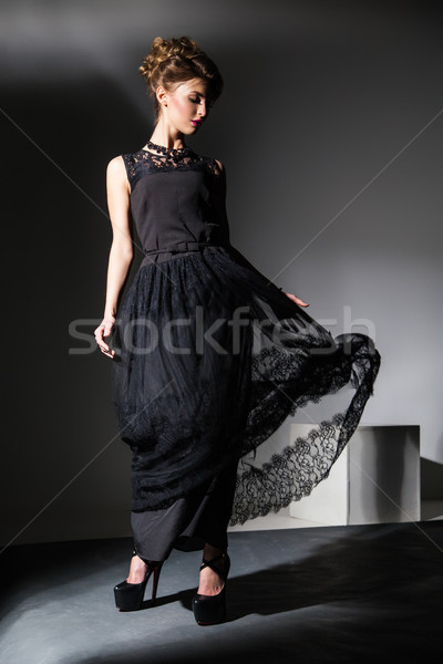 Piękna model czarna sukienka ruchu portret elegancki Zdjęcia stock © julenochek