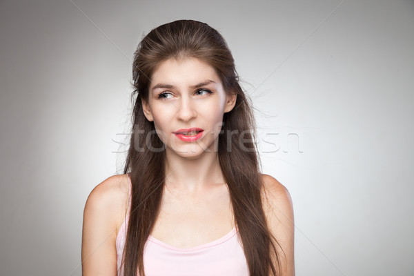 Stock photo: Messed up girl biting her lips.