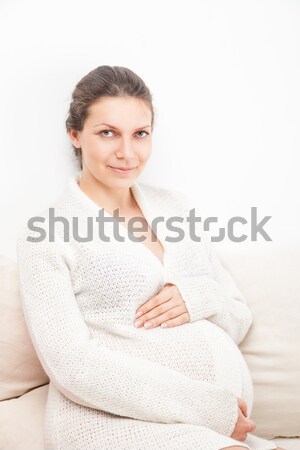 Happy Pregnant woman  over white background Stock photo © julenochek