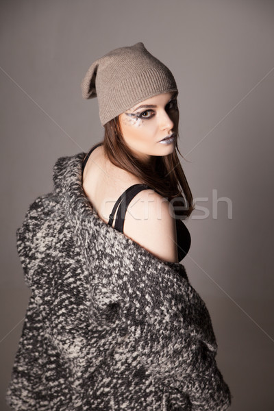young woman turned looking over her shoulder .  Stock photo © julenochek