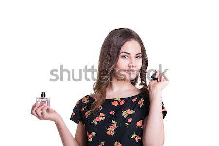 Mulher jovem cheiro perfume mão sorrir Foto stock © julenochek