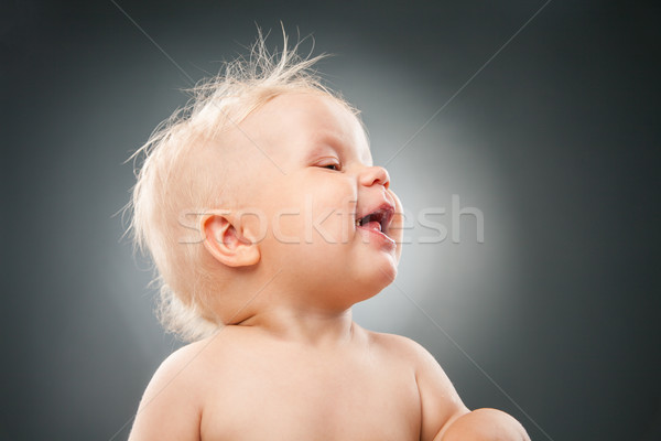 Smiling baby with messy hair looking away Stock photo © julenochek