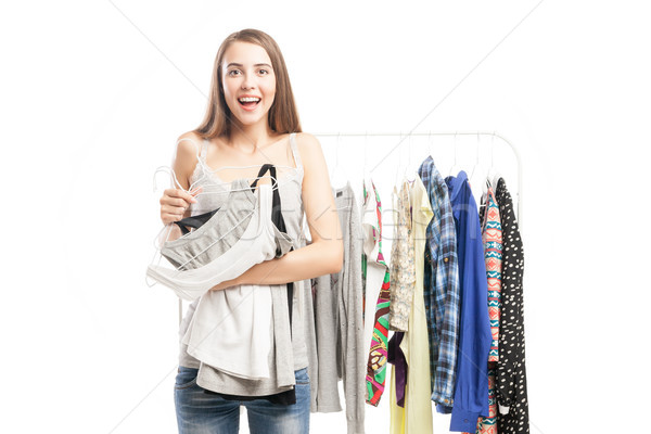 Happy woman holding several tops  Stock photo © julenochek