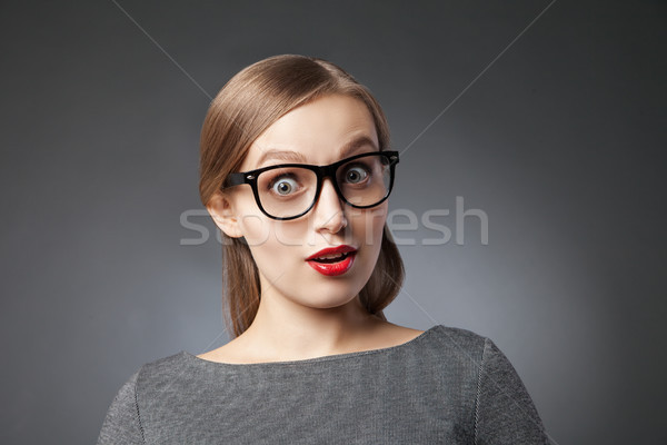 Mulher cinza retrato surpreendido óculos olhando Foto stock © julenochek