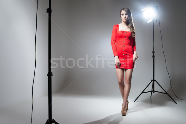 Jeunes modèle robe rouge posant Spotlight séduisant [[stock_photo]] © julenochek
