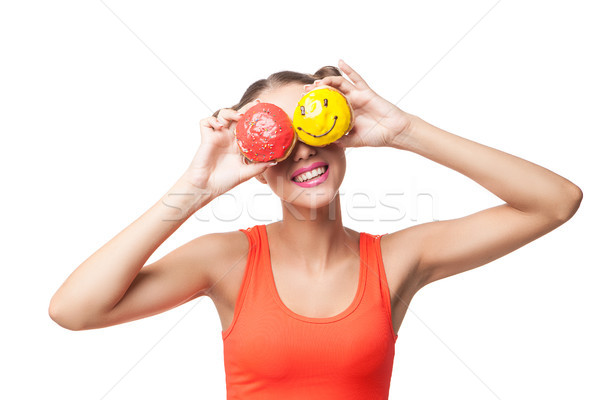 Young smiling woman covering eyes with donuts Stock photo © julenochek