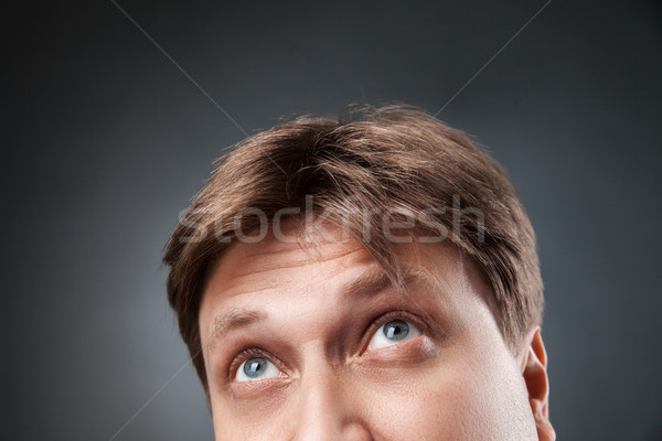 Close-up of adult man looking up Stock photo © julenochek