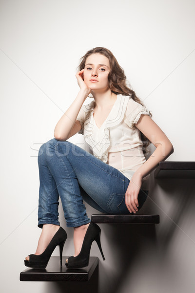 портрет брюнетка сидят шаги стены красивой Сток-фото © julenochek
